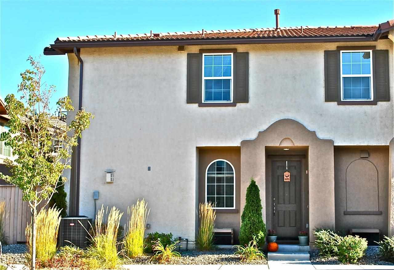 1864 Wind Ranch Road, Unit A Reno, NV 89521 - Photo 1 of 1 a front view of a house with a yard