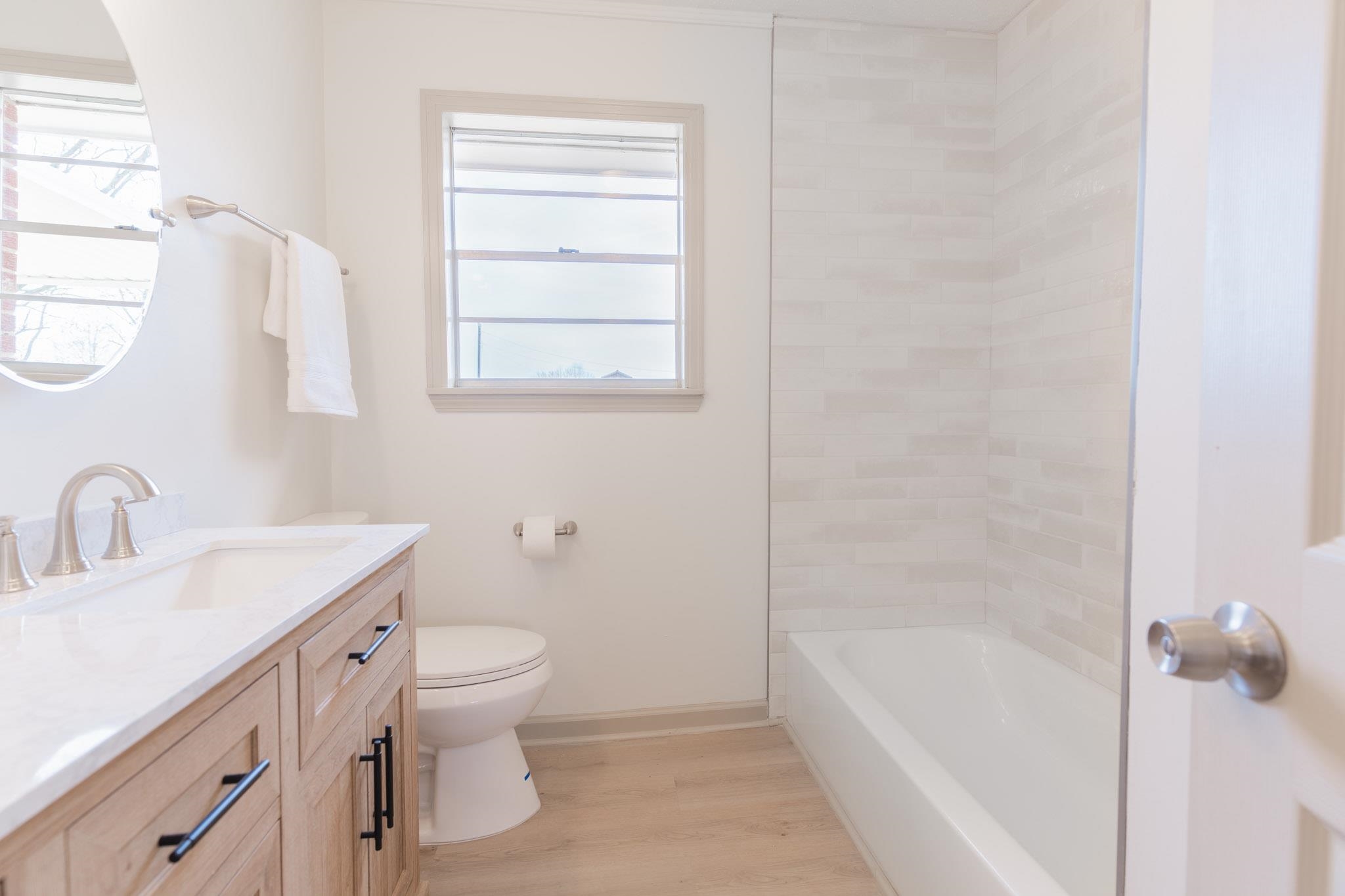 3616 Jack Pond Road Mason, TN 38049 - Photo 14 of 23 a bathroom with a granite countertop sink a toilet and a bathtub