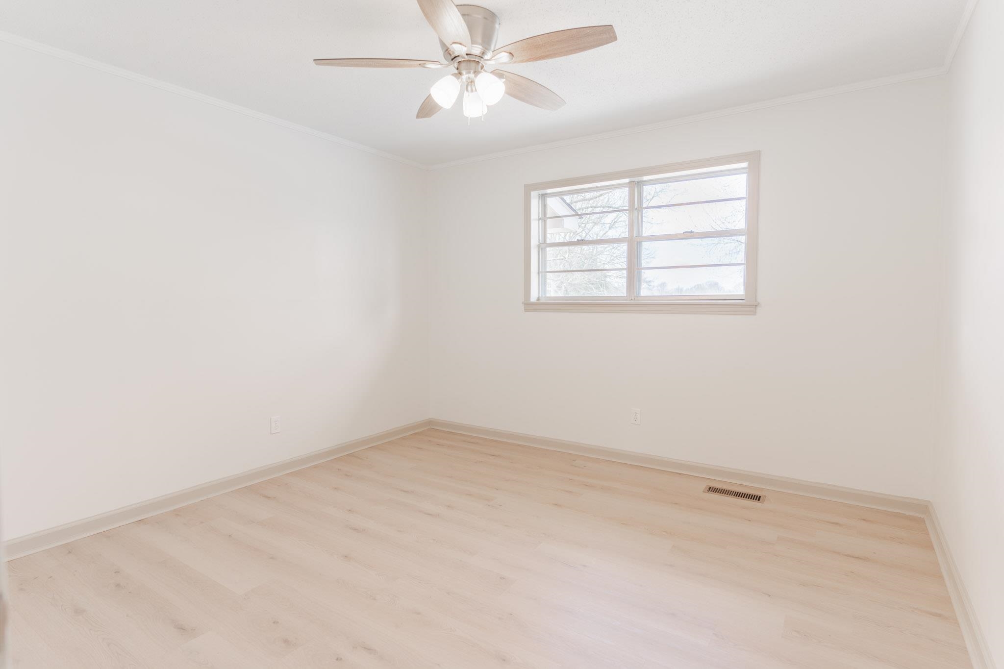 3616 Jack Pond Road Mason, TN 38049 - Photo 16 of 23 an empty room with a window and a fan