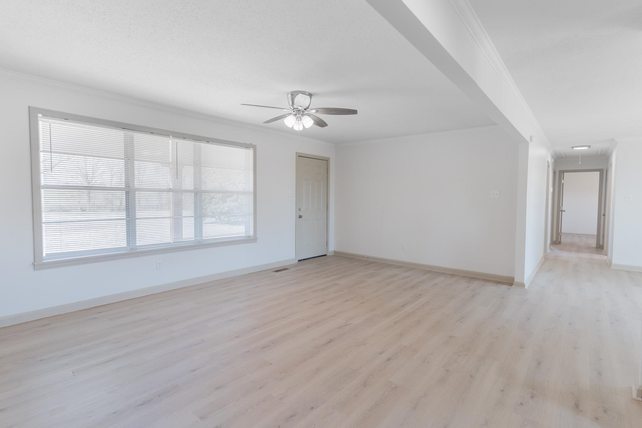 3616 Jack Pond Road Mason, TN 38049 - Photo 4 of 23 wooden floor in an empty room with a window
