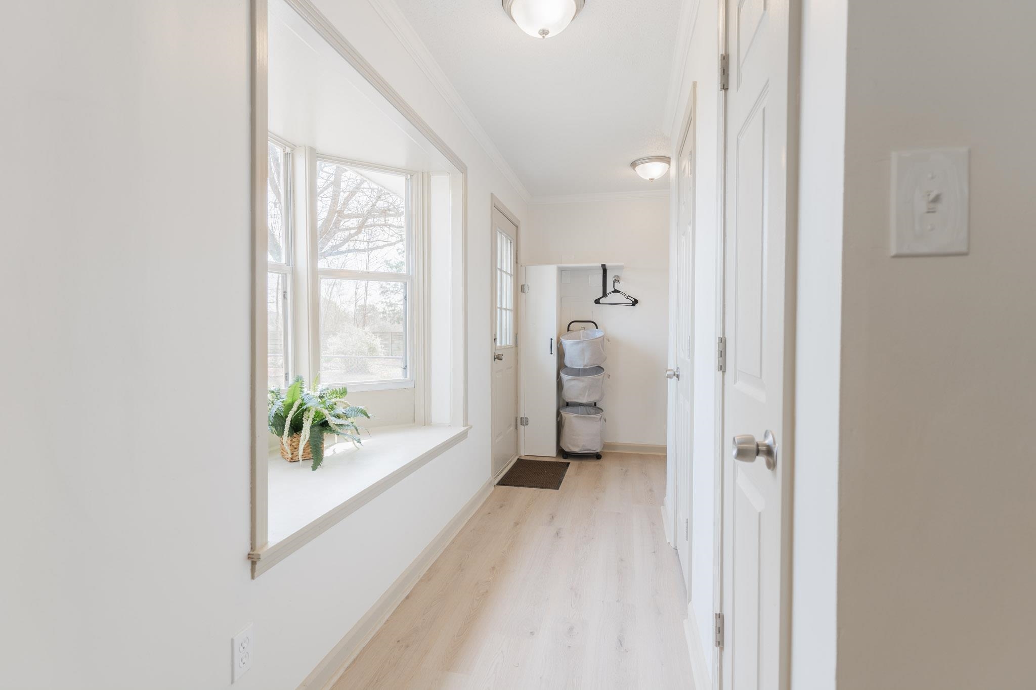 3616 Jack Pond Road Mason, TN 38049 - Photo 8 of 23 a view of a hallway with wooden floor and a bathroom