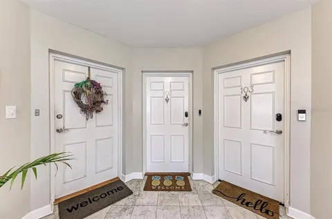 a view of a hallway with front door