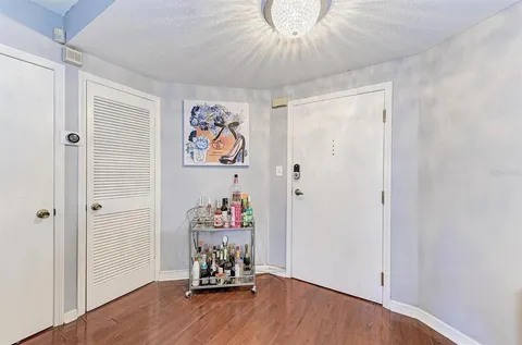 a view of a room with toys and wooden floor