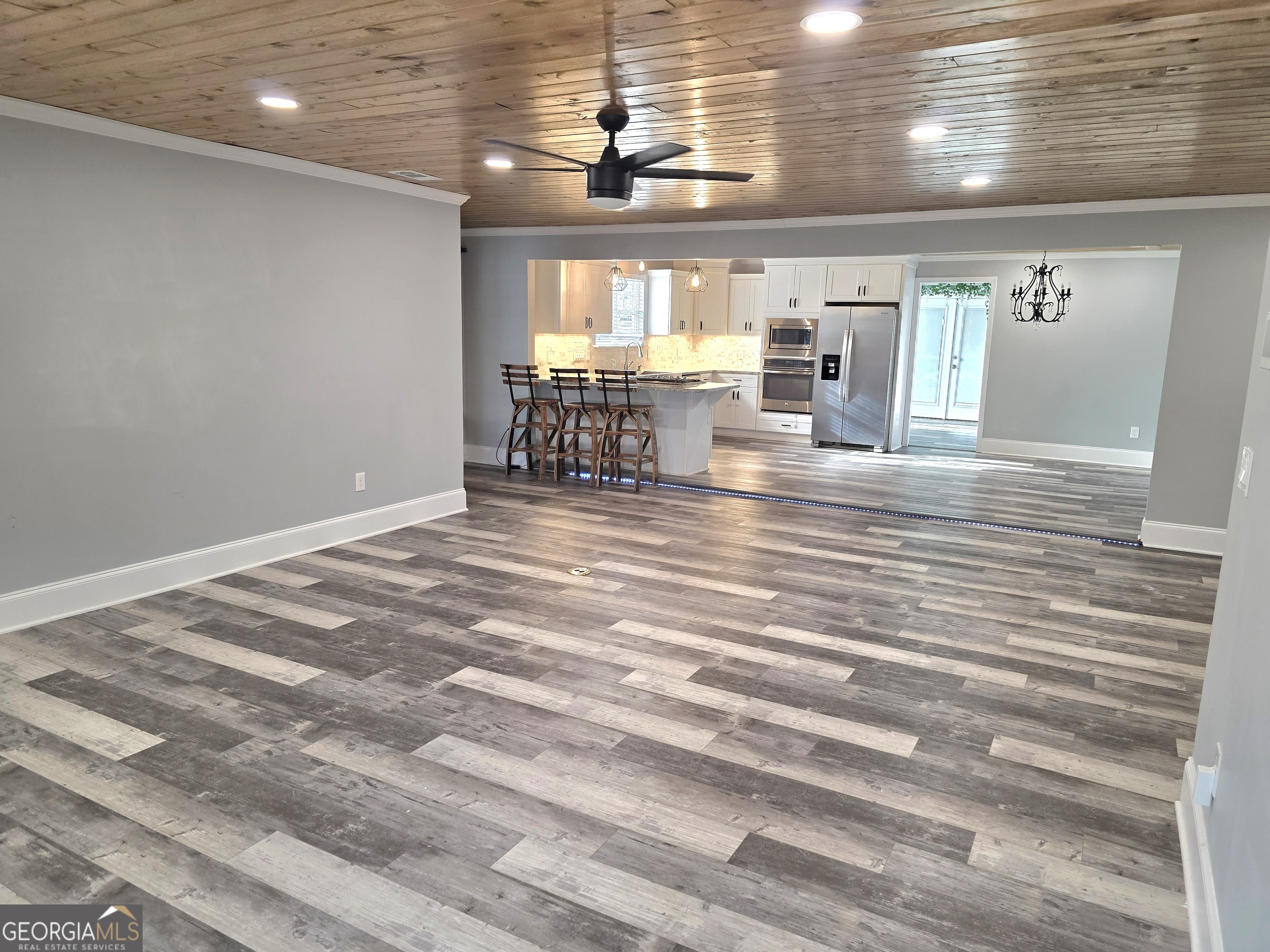 391 Price Street Statham, GA 30666 - Photo 11 of 41 a view of a room with window and wooden floor