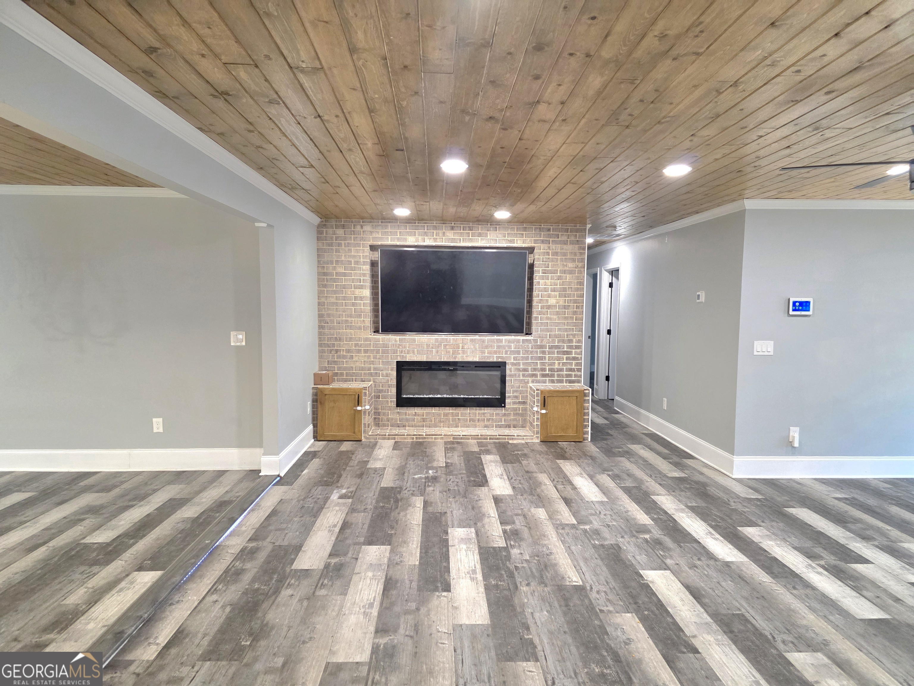 391 Price Street Statham, GA 30666 - Photo 15 of 41 a view of an empty room with a fireplace