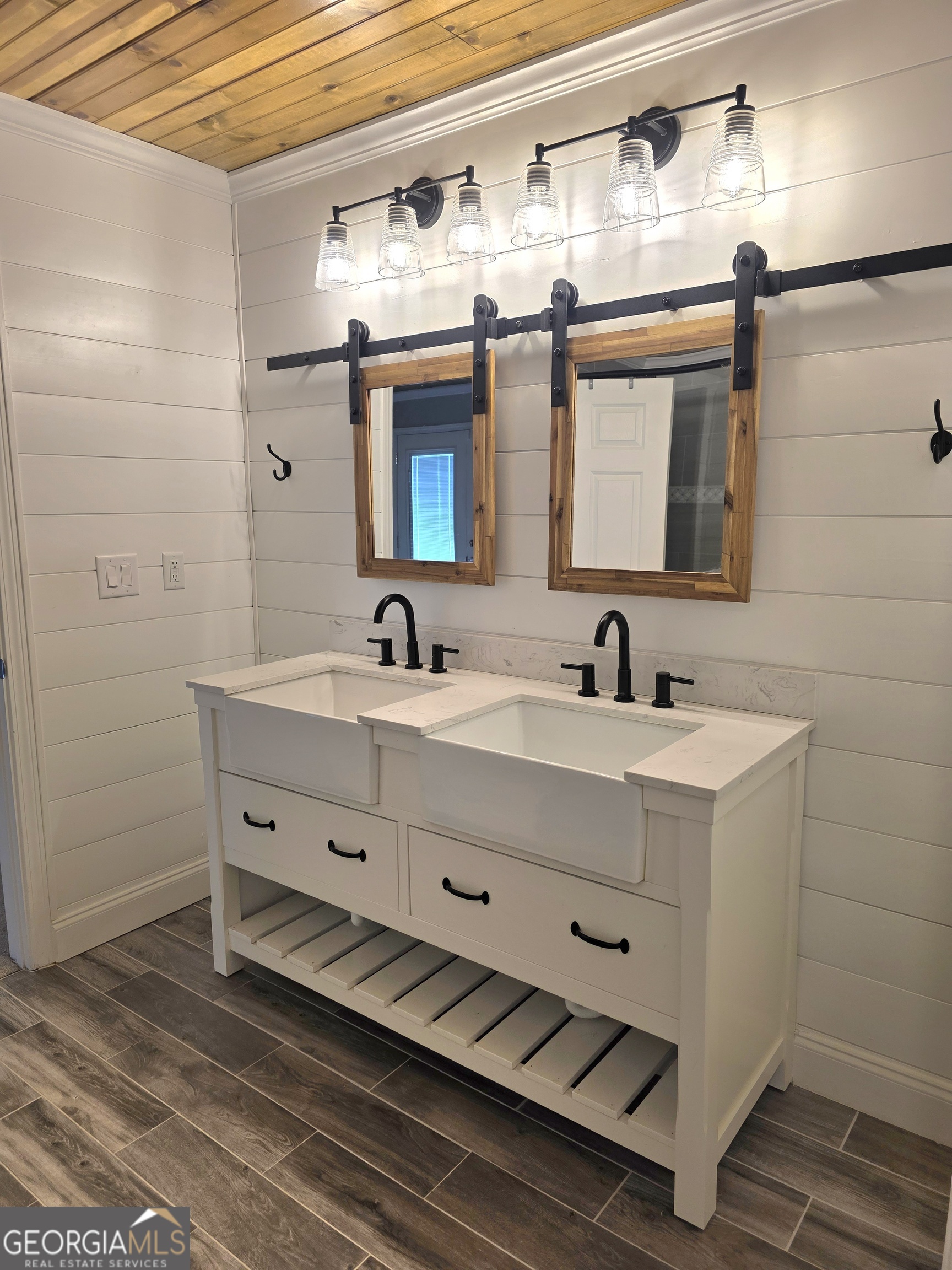 391 Price Street Statham, GA 30666 - Photo 21 of 41 a bathroom with double vanity sink and two mirror