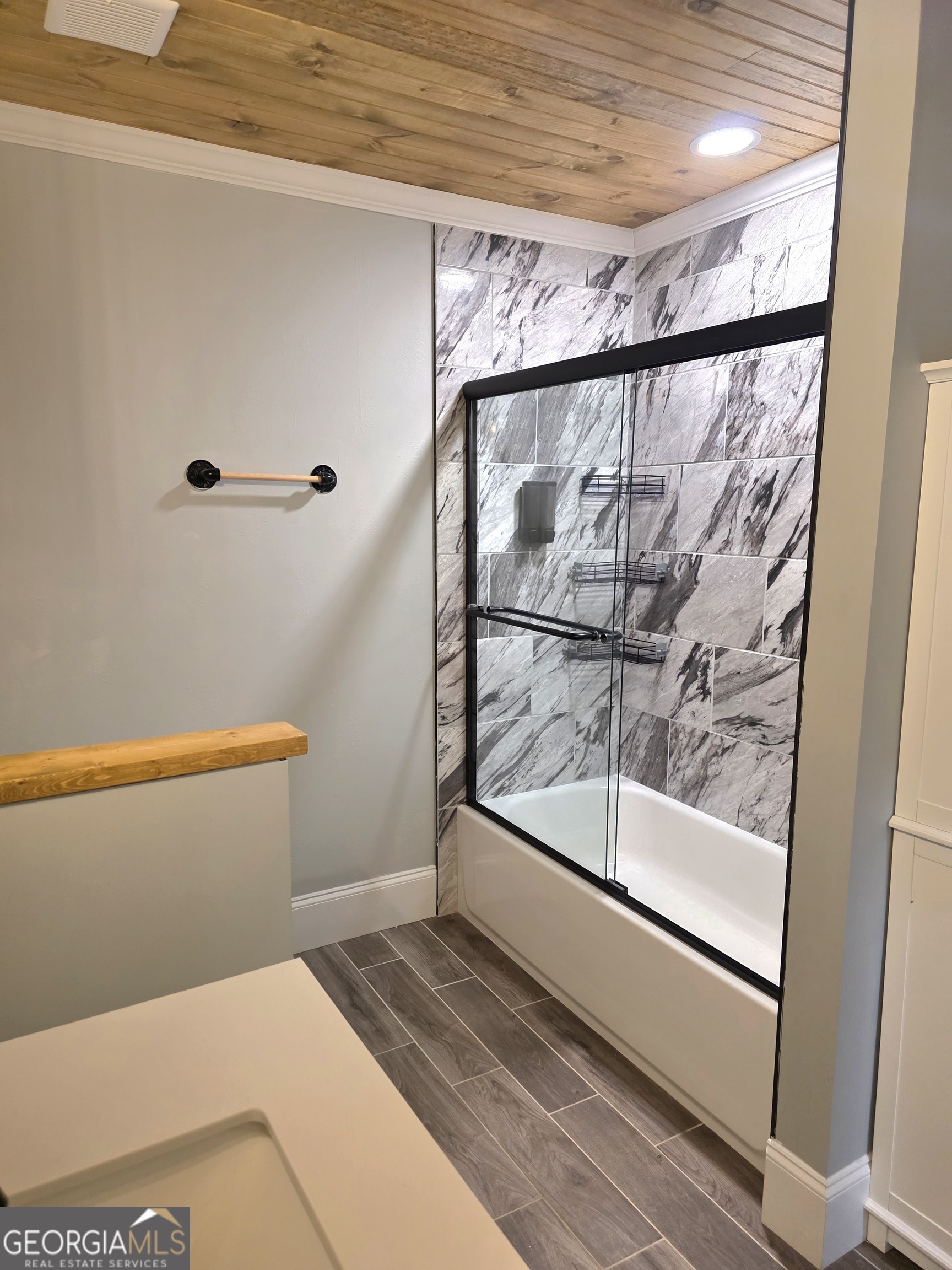 391 Price Street Statham, GA 30666 - Photo 33 of 41 a bathroom with a bathtub and a shower