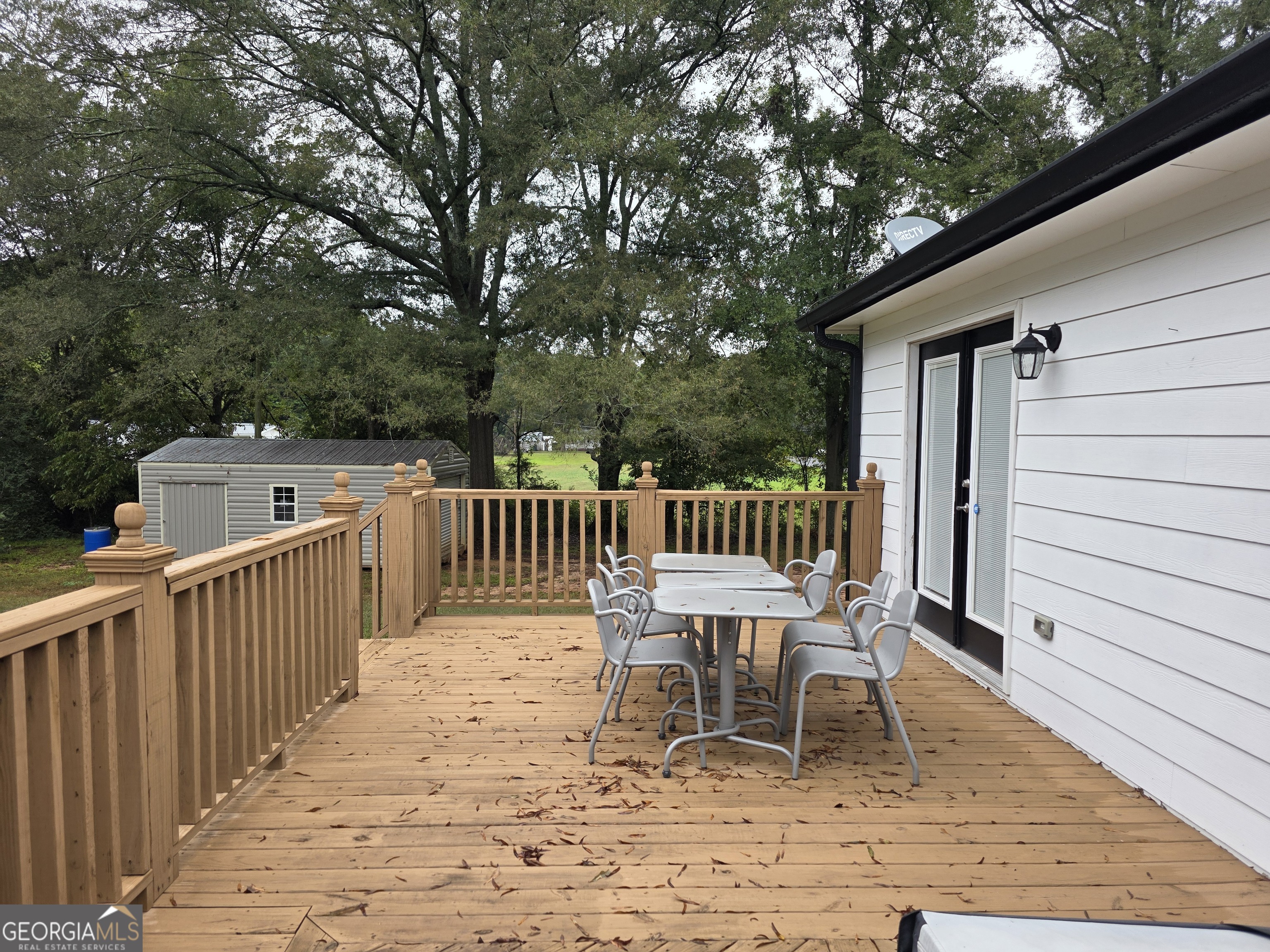 391 Price Street Statham, GA 30666 - Photo 37 of 41 a balcony with wooden floor and fence