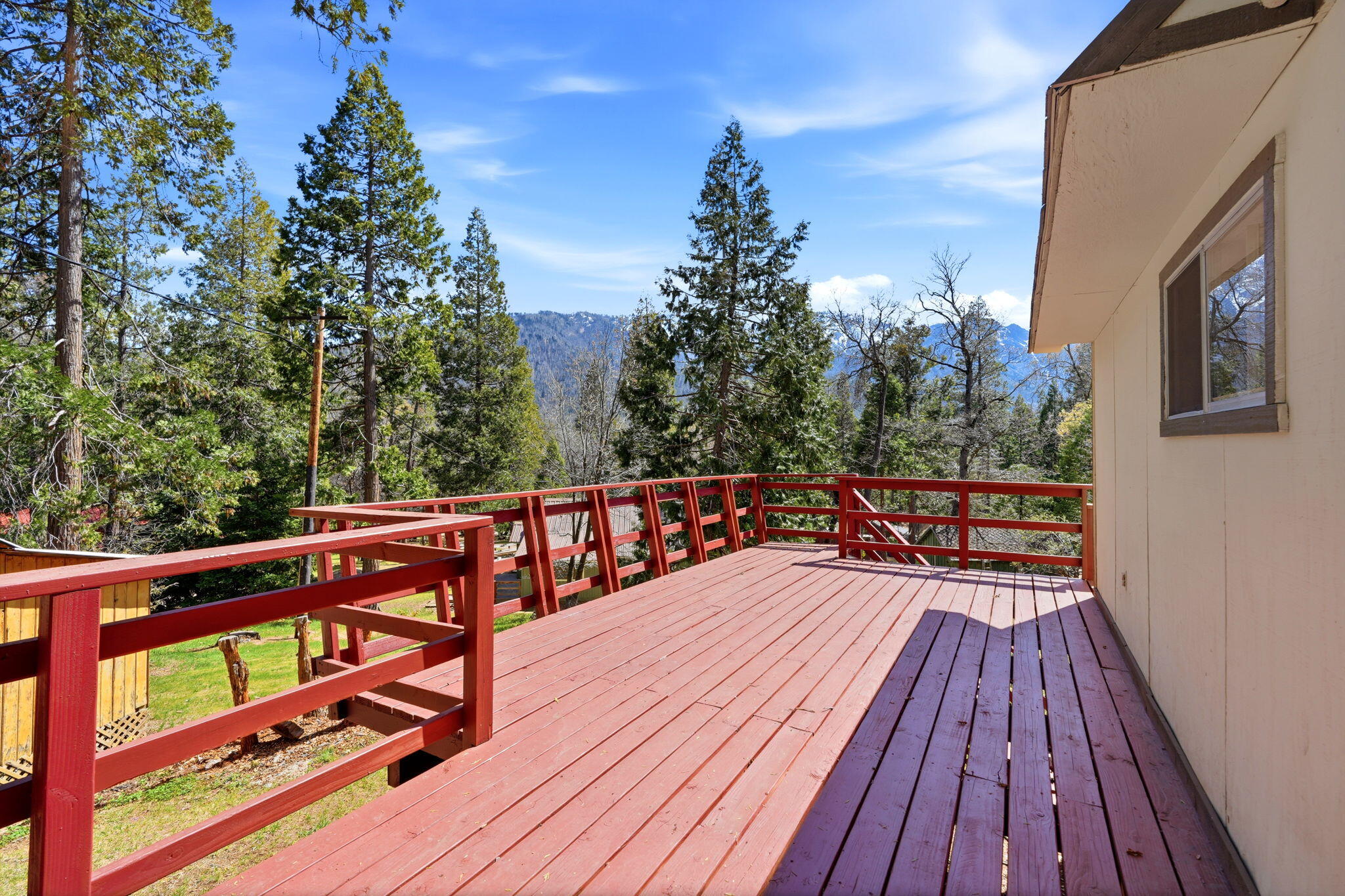 697 Loop Drive Springville, CA 93265 - Photo 9 of 55 a balcony with wooden floor and outdoor seating