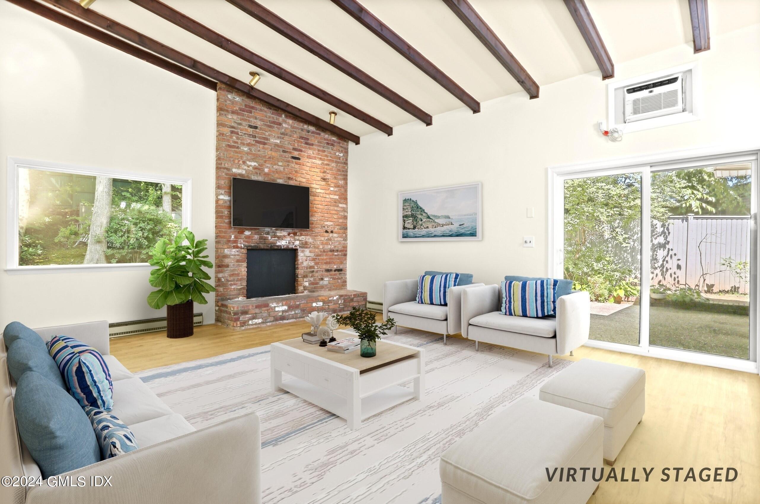 66 Arch Street Riverside, CT 06878 - Photo 11 of 30 a living room with furniture and a fireplace