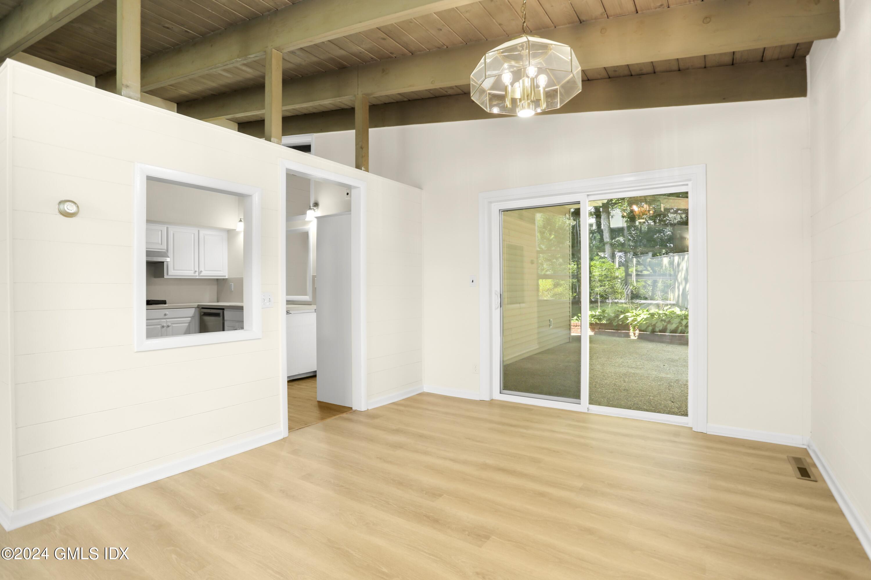 66 Arch Street Riverside, CT 06878 - Photo 12 of 30 a view of an empty room with wooden floor