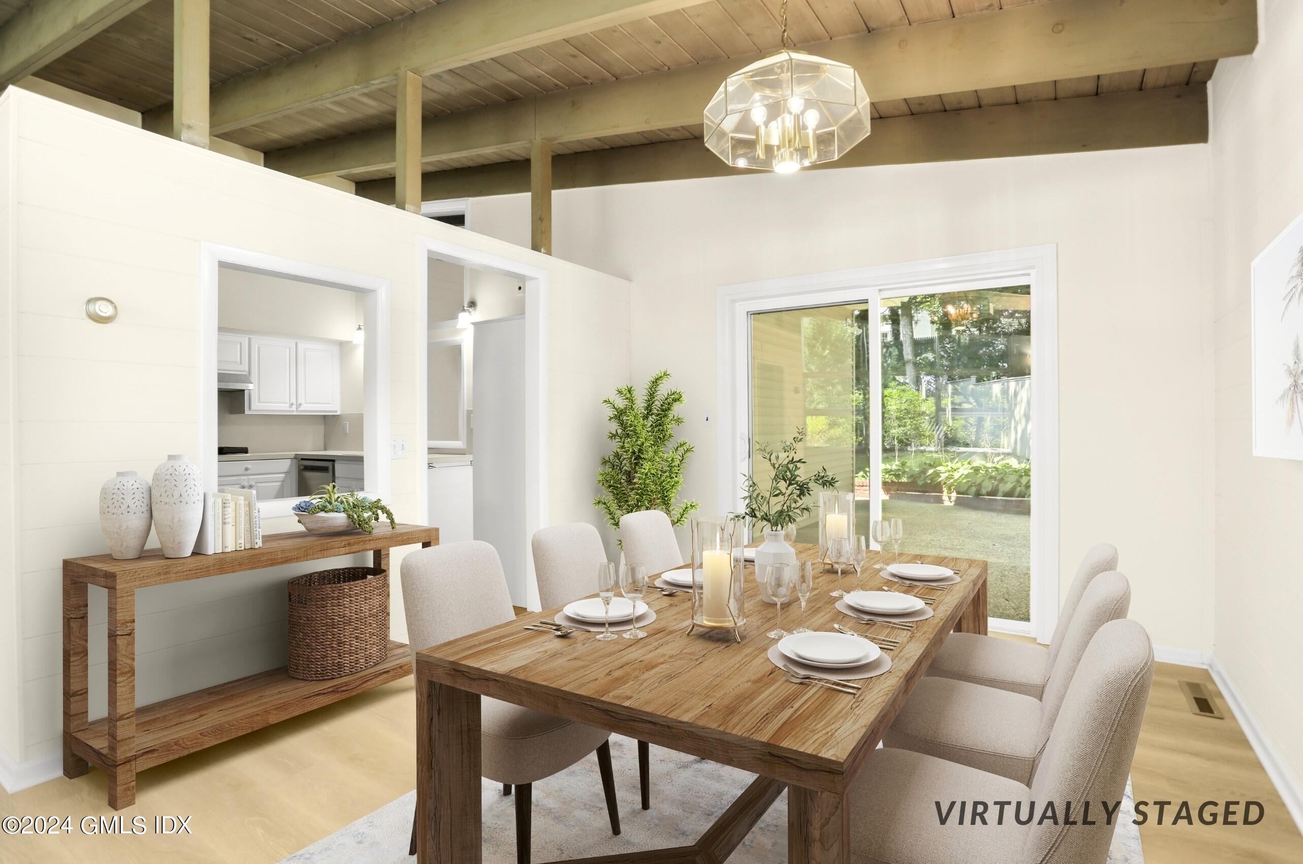 66 Arch Street Riverside, CT 06878 - Photo 13 of 30 a view of a dining room with furniture window and outside view