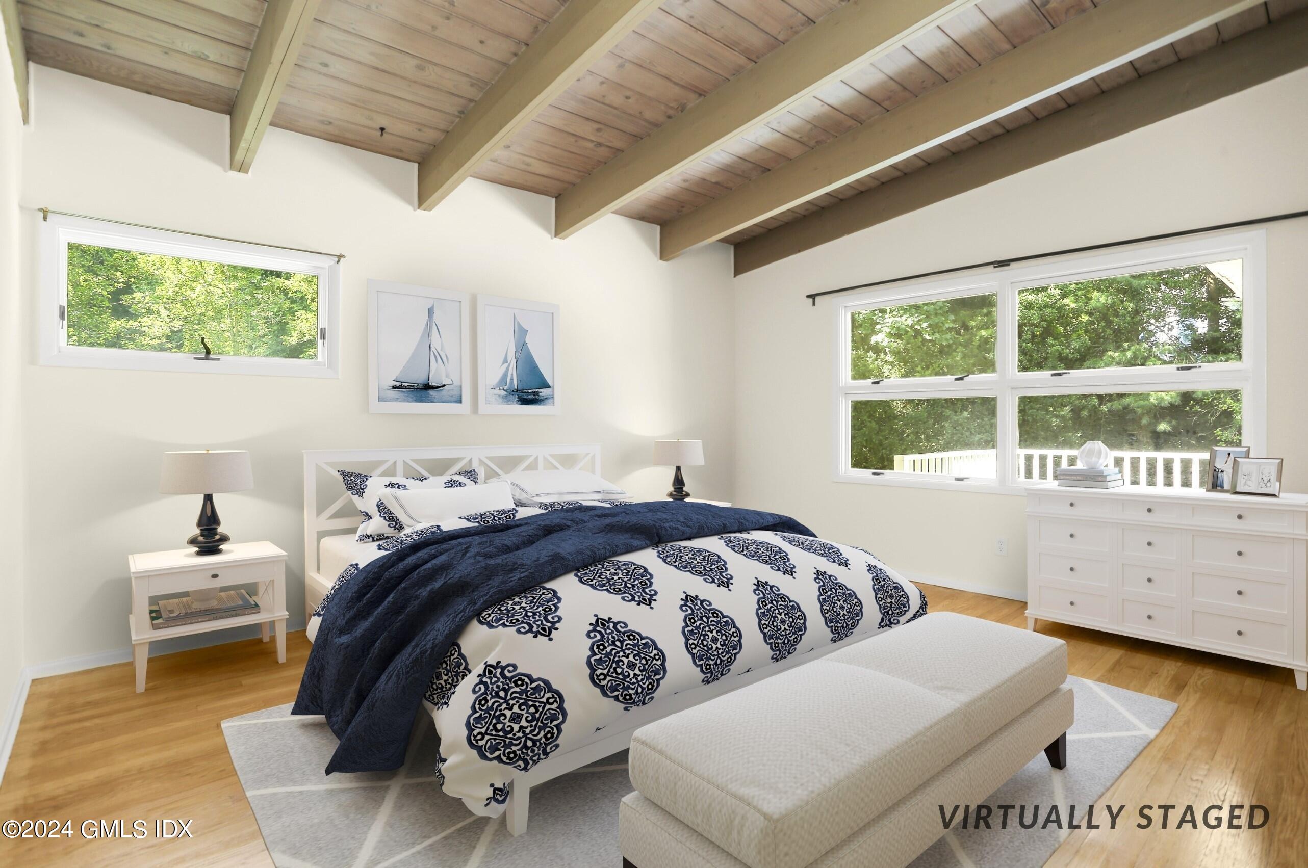 66 Arch Street Riverside, CT 06878 - Photo 15 of 30 a bedroom with a large bed and a window