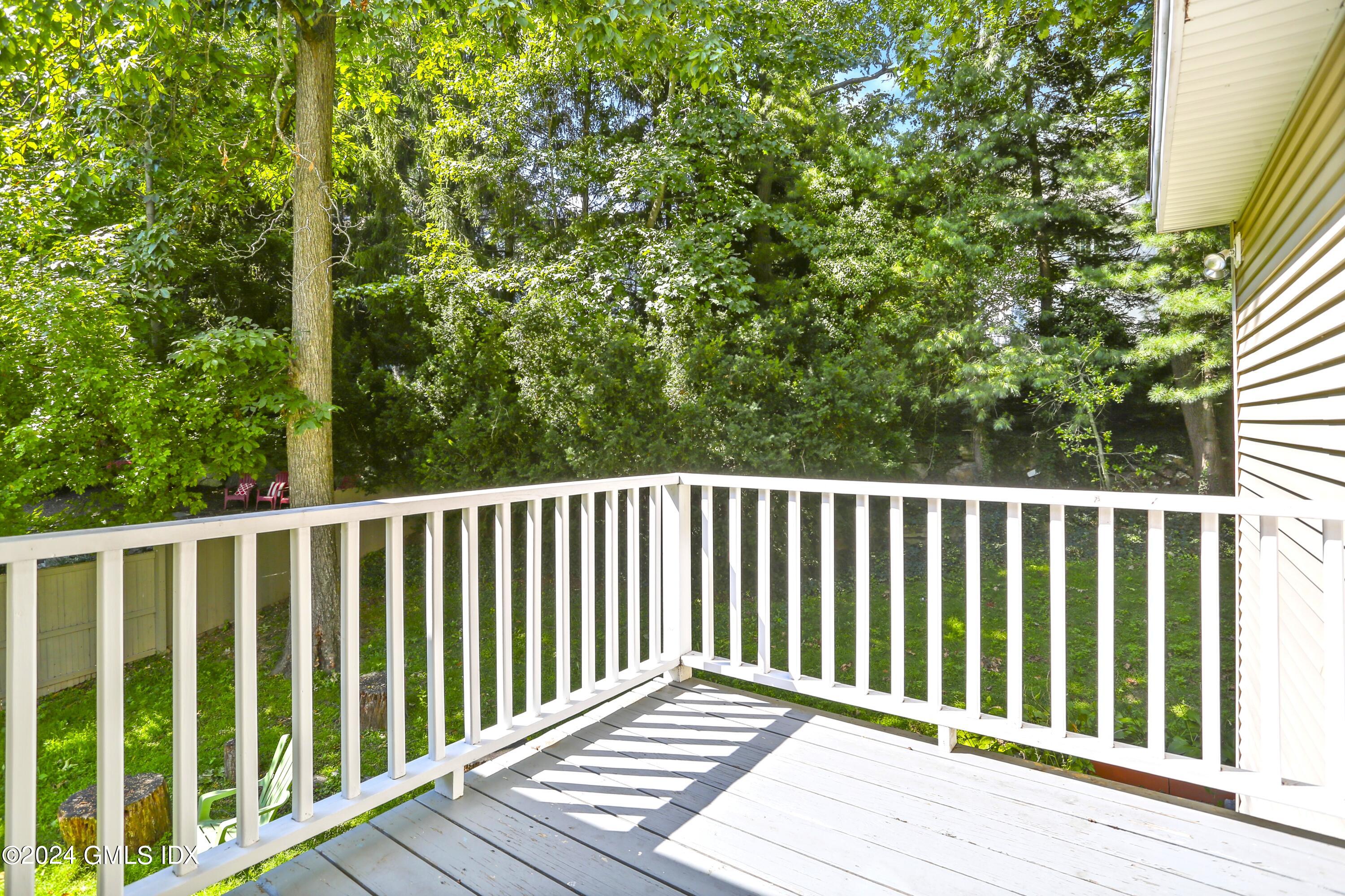 66 Arch Street Riverside, CT 06878 - Photo 20 of 30 a balcony with wooden floor