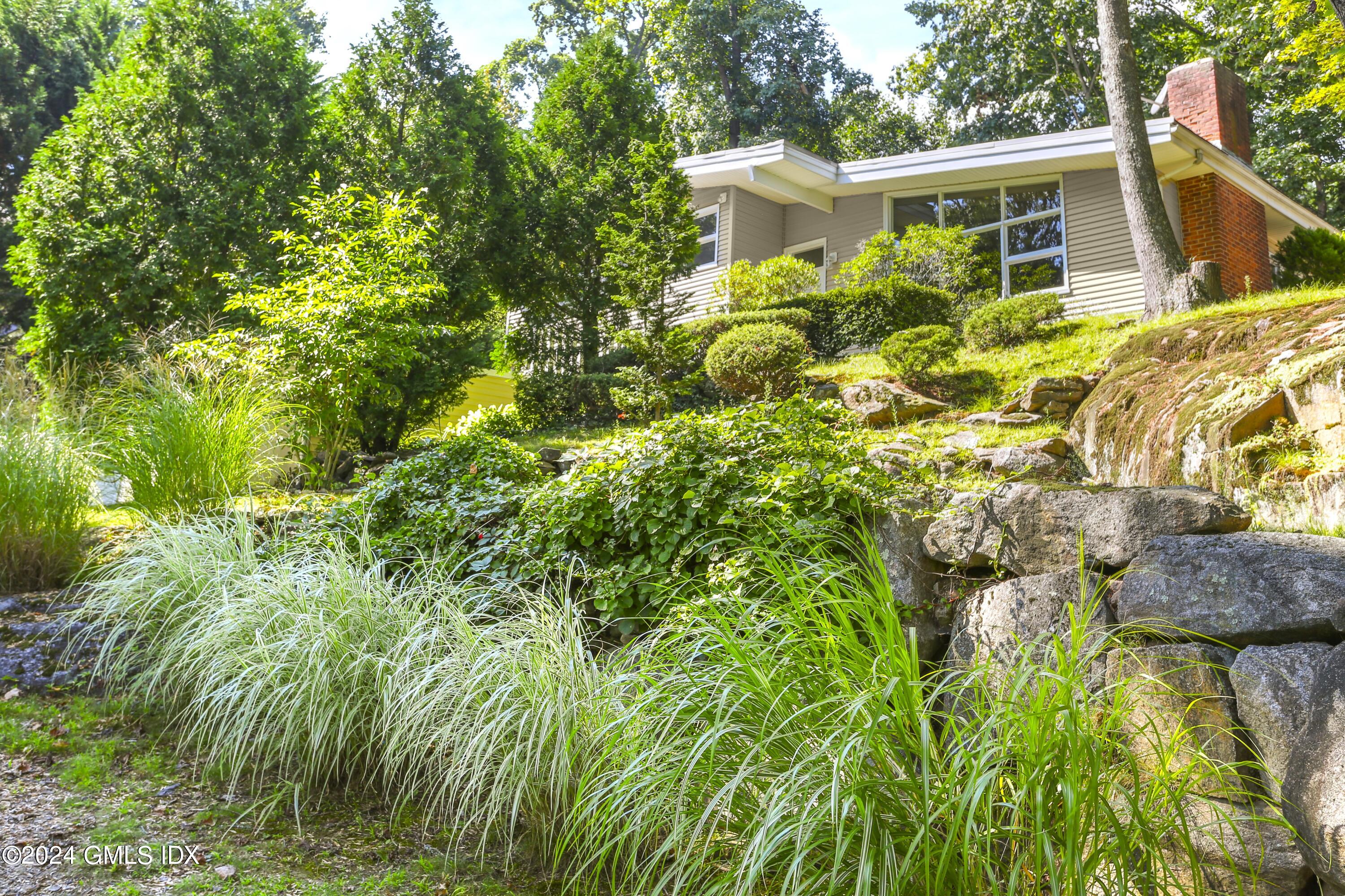 66 Arch Street Riverside, CT 06878 - Photo 2 of 30 a view of a house with a yard