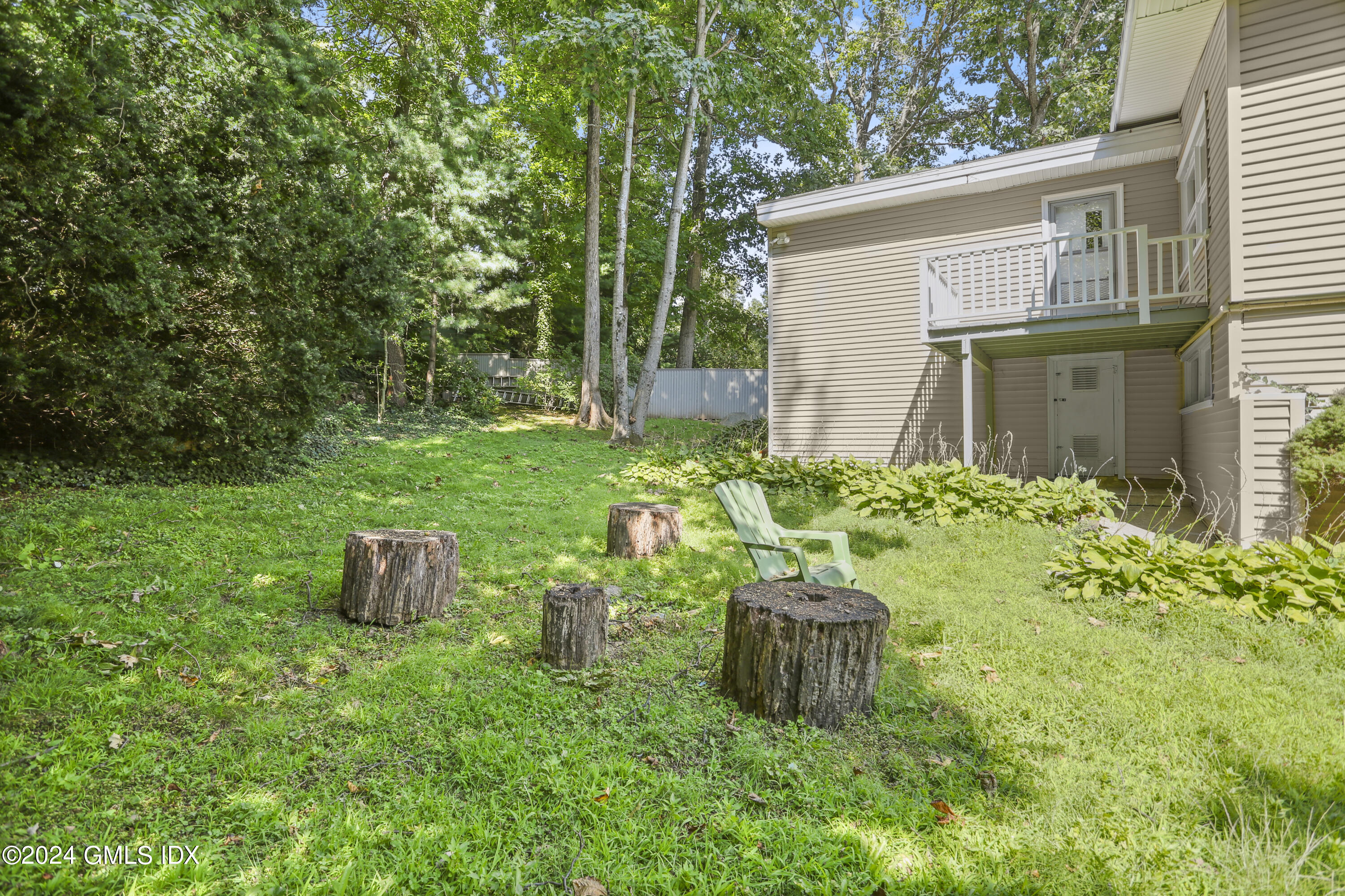 66 Arch Street Riverside, CT 06878 - Photo 21 of 30 a view of a house with backyard and garden
