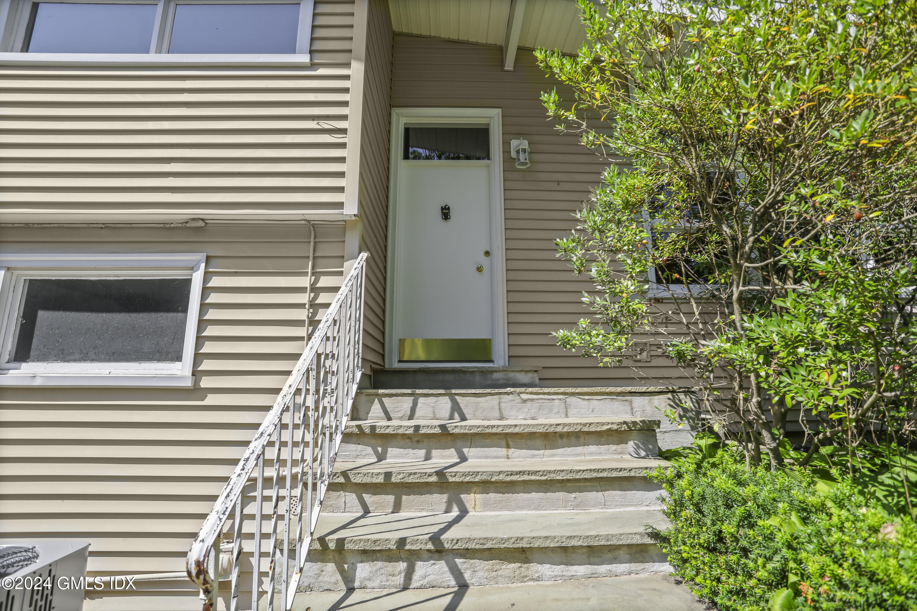66 Arch Street Riverside, CT 06878 - Photo 3 of 30 a view of a pathway of the house