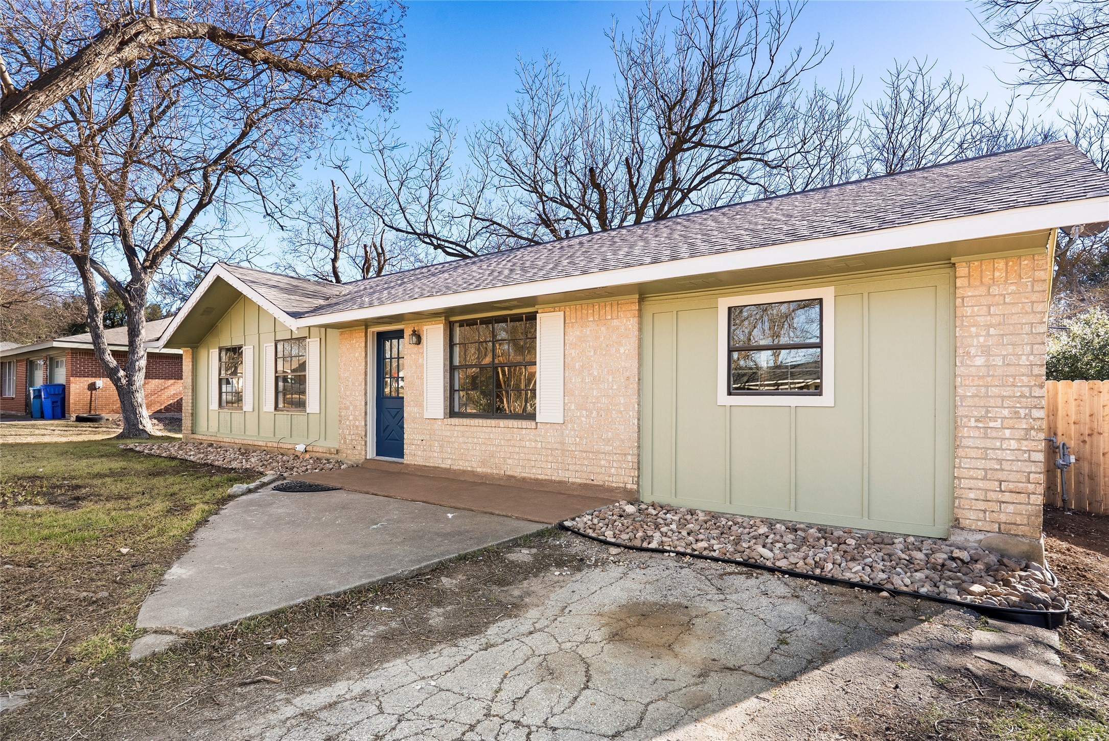 616 Mogonye Lane Elgin, TX 78621 - Photo 25 of 26 Single story home with board and batten siding, & brick siding.