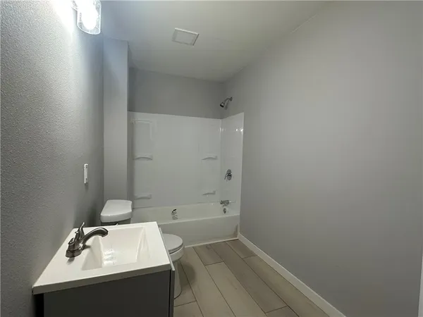 a bathroom with a sink and bathtub