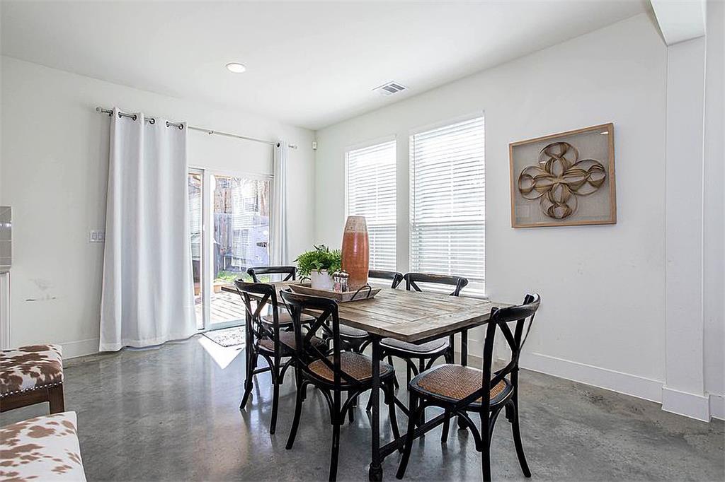 1311 Fort Branch Boulevard Austin, TX 78721 - Photo 13 of 27 Dining area featuring visible vents, finished concrete flooring, and baseboards