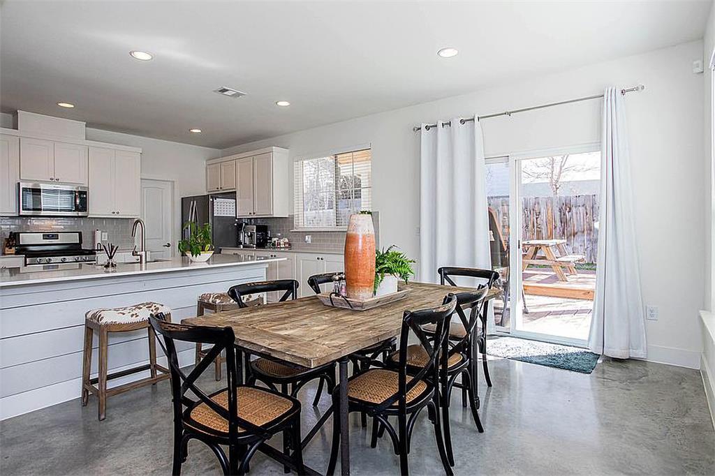 1311 Fort Branch Boulevard Austin, TX 78721 - Photo 14 of 27 Dining space featuring plenty of natural light, recessed lighting, visible vents, and concrete flooring