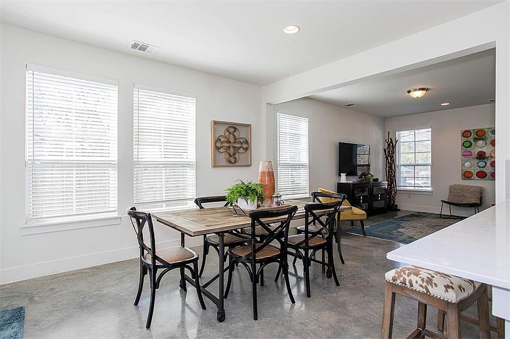 1311 Fort Branch Boulevard Austin, TX 78721 - Photo 16 of 27 Dining room featuring recessed lighting, baseboards, visible vents, and concrete flooring