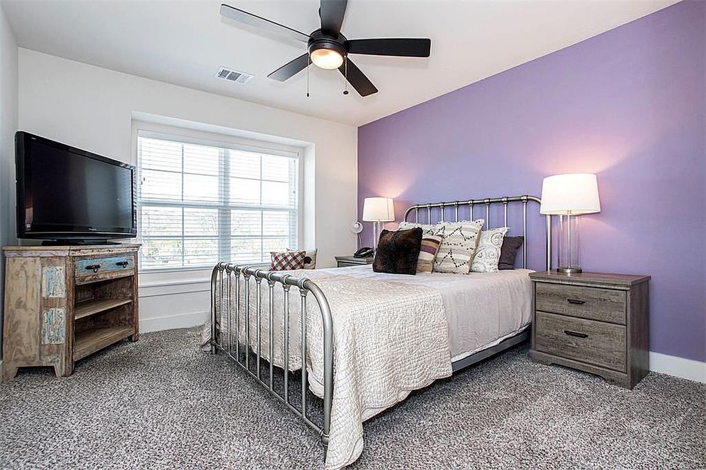 1311 Fort Branch Boulevard Austin, TX 78721 - Photo 22 of 27 Carpeted bedroom with visible vents, baseboards, and ceiling fan