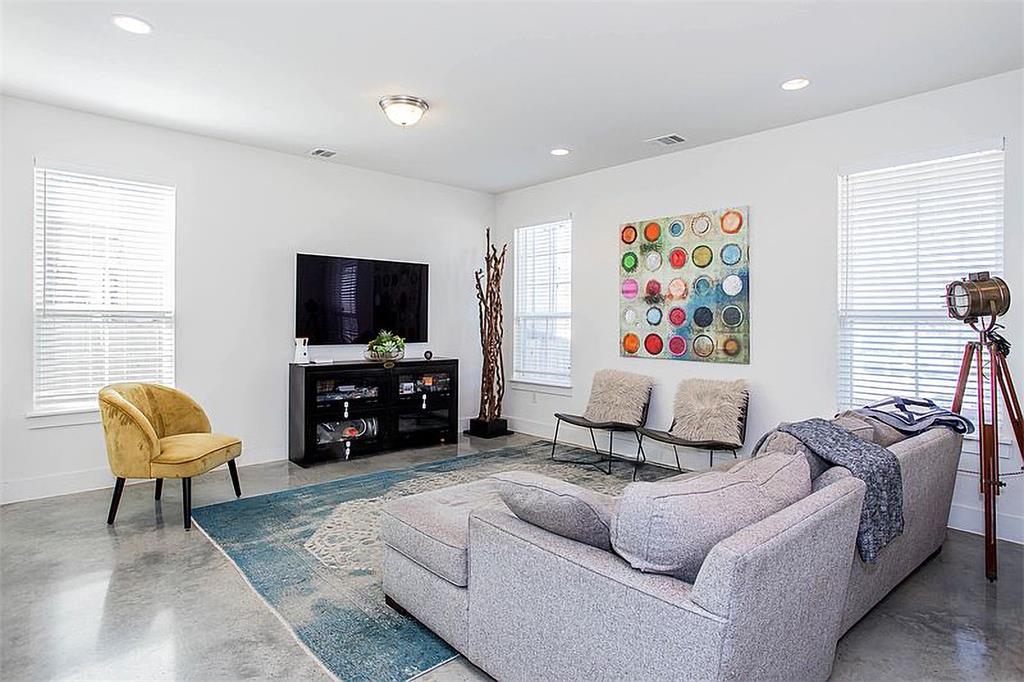 1311 Fort Branch Boulevard Austin, TX 78721 - Photo 5 of 27 Living room with recessed lighting, visible vents, baseboards, and finished concrete floors
