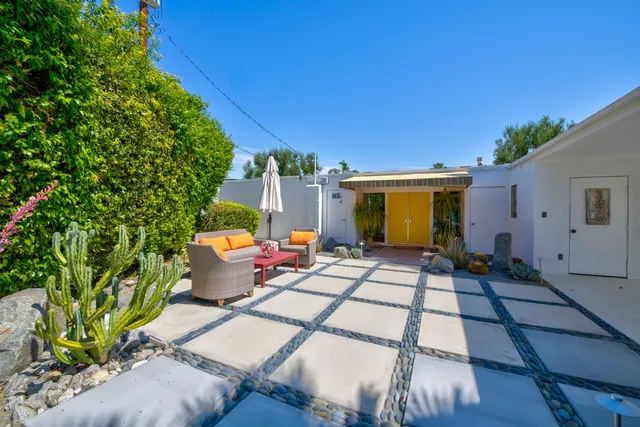 a view of house with patio outdoor seating