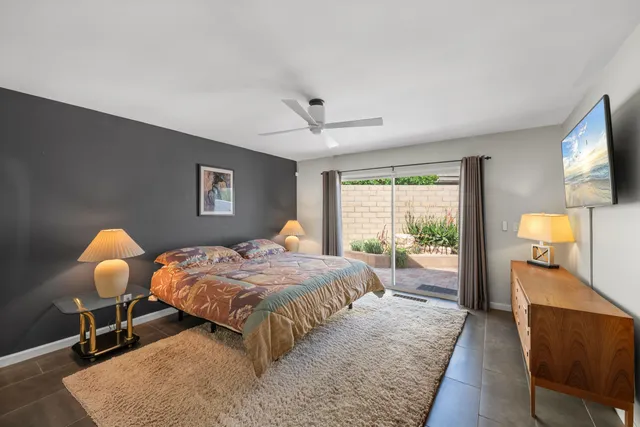 a bed room with a bed and a chandelier