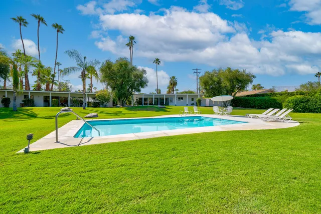 a view of a park with houses