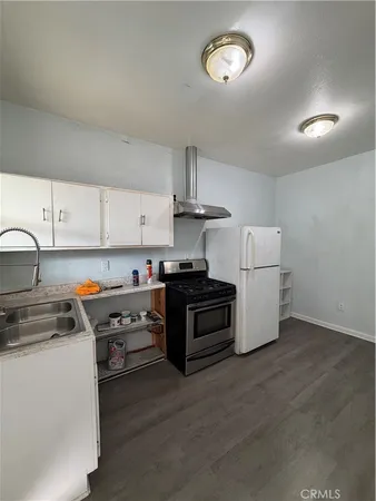 a kitchen with a stove and a sink