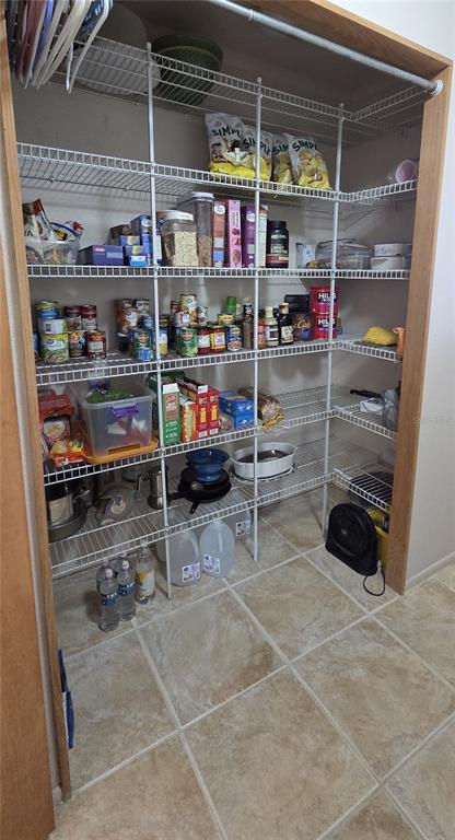 2076 River Basin Terrace Punta Gorda, FL 33982 - Photo 16 of 38 a view of store room with racks