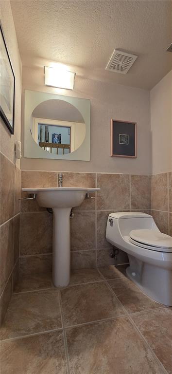 2076 River Basin Terrace Punta Gorda, FL 33982 - Photo 18 of 38 a bathroom with a toilet sink and mirror