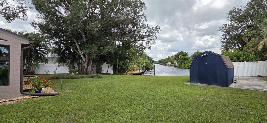 2076 River Basin Terrace Punta Gorda, FL 33982 - Photo 30 of 38 a view of a backyard with large trees