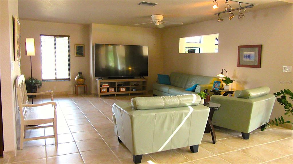 2076 River Basin Terrace Punta Gorda, FL 33982 - Photo 5 of 38 a living room with furniture and a flat screen tv