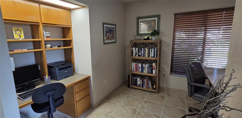 2076 River Basin Terrace Punta Gorda, FL 33982 - Photo 7 of 38 a room with bookshelf and a window