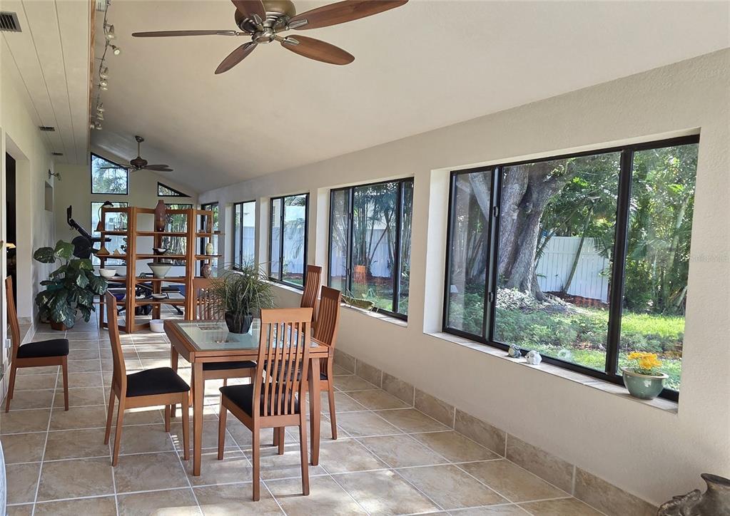2076 River Basin Terrace Punta Gorda, FL 33982 - Photo 10 of 38 a dining room with furniture and a floor to ceiling window