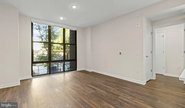 a view of a hallway with washer and dryer