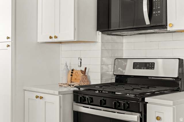 189 West Center Street Midvale, UT 84047 - Photo 16 of 64 Detail of stainless steel range and microwave appliances ready for that special meal!