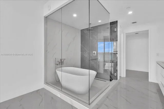 a bathroom with a double vanity sink and mirror
