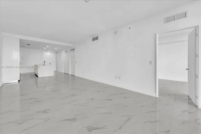 a bathroom with a granite countertop sink and vanity