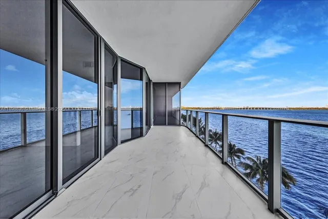 a view of swimming pool and brick wall