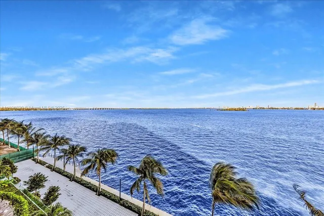 a view of water with building and lake view