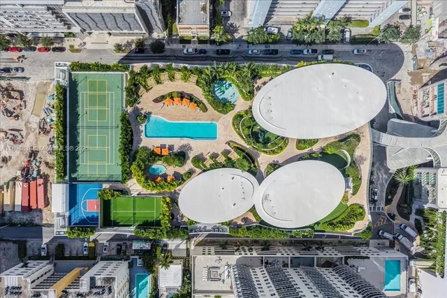 a view of a building next to a yard