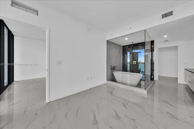 a view of an empty room with a window