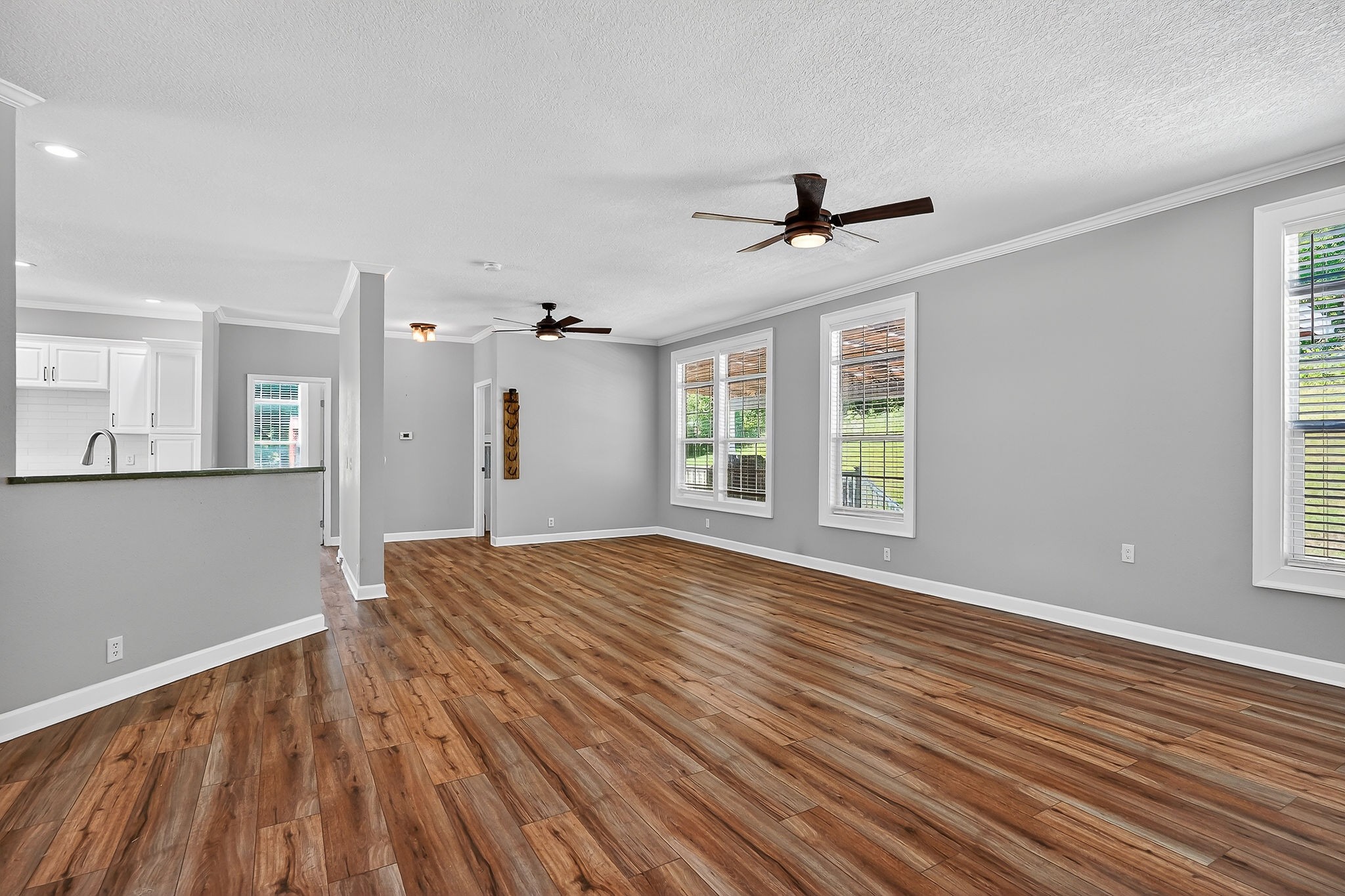 16062 Buffalo Valley Road Silver Point, TN 38582 - Photo 5 of 27 a view of empty room with wooden floor and fan