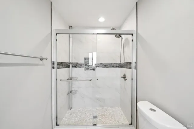 a bathroom with 2 sink and a mirror