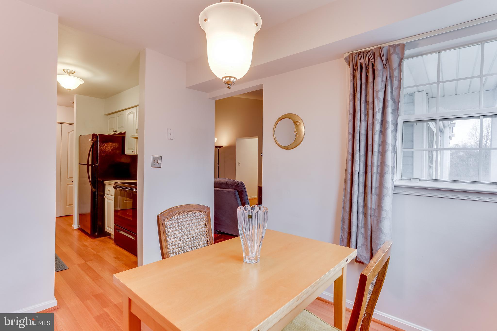 8513 Falls Run Road, Unit J Ellicott City, MD 21043 - Photo 12 of 30 Dining Room- Opens to Living Room