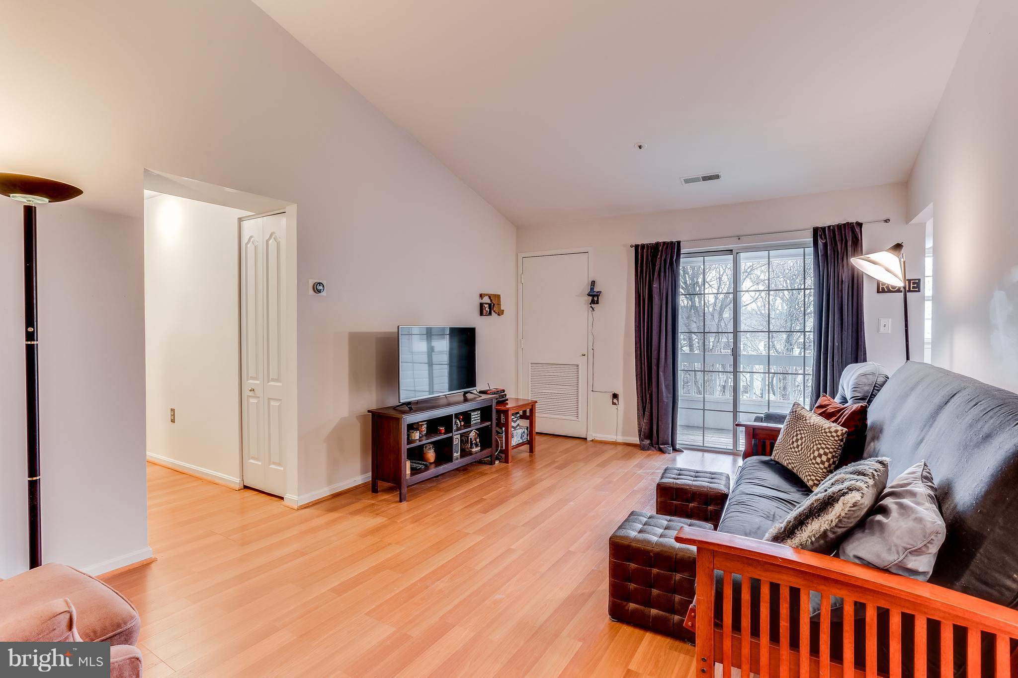 8513 Falls Run Road, Unit J Ellicott City, MD 21043 - Photo 15 of 30 Living Room- Wood Laminate Throughout